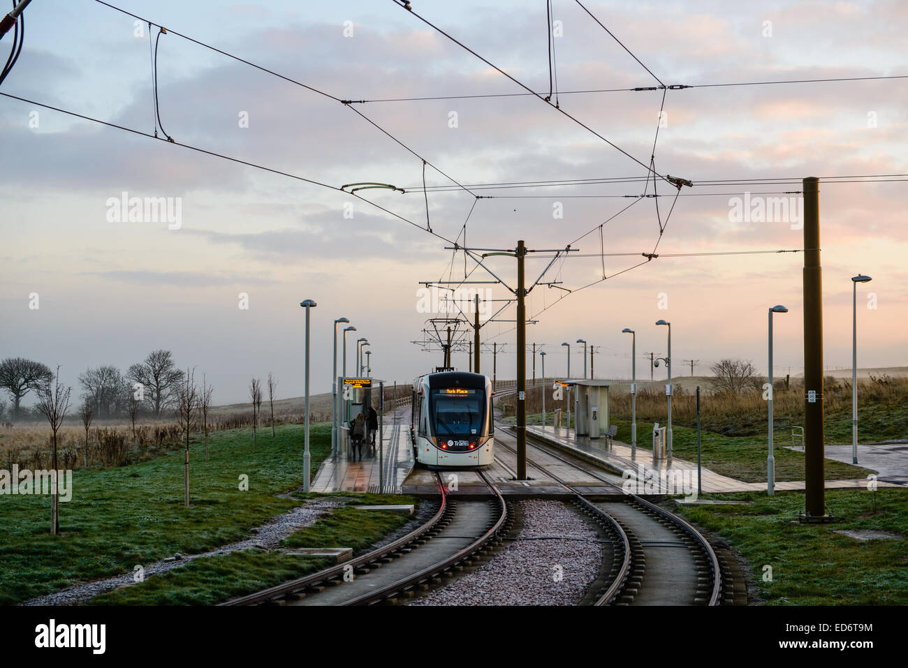 A tram sits at the station at Ingliston Park & Ride, on it