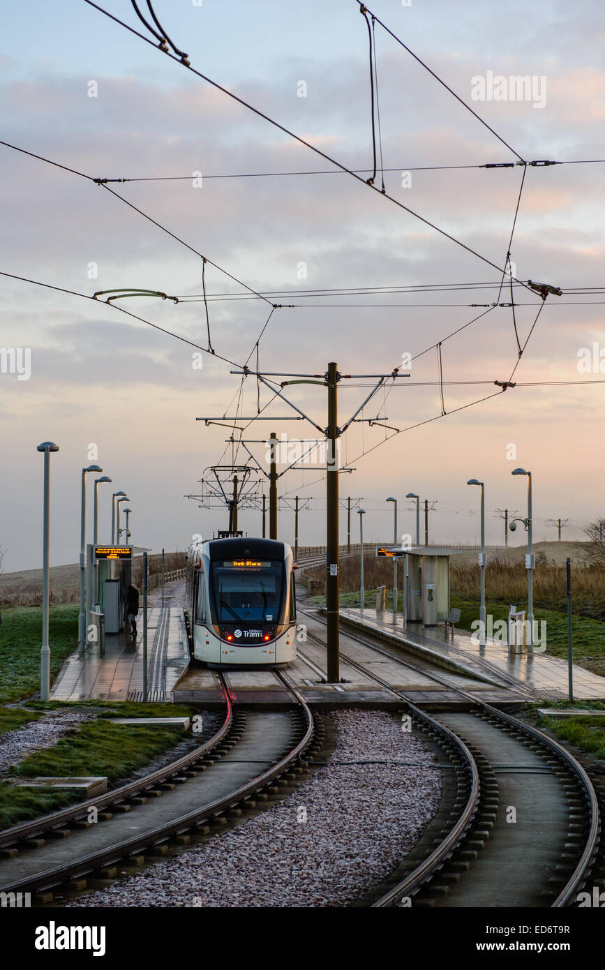 A tram sits at the station at Ingliston Park & Ride, on it
