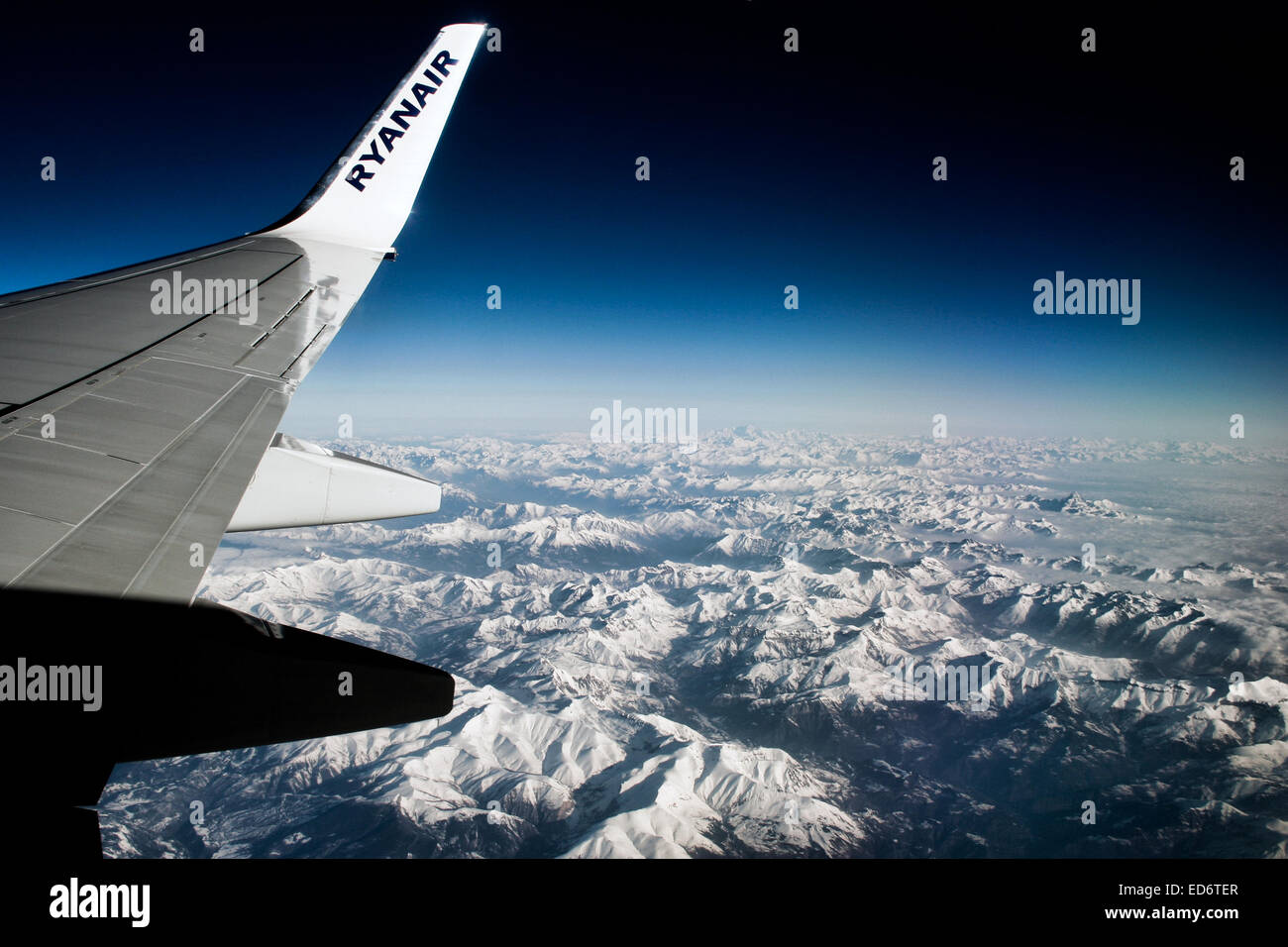 Ryanair Boeing 737-800 flying over the Alps. Stock Photo