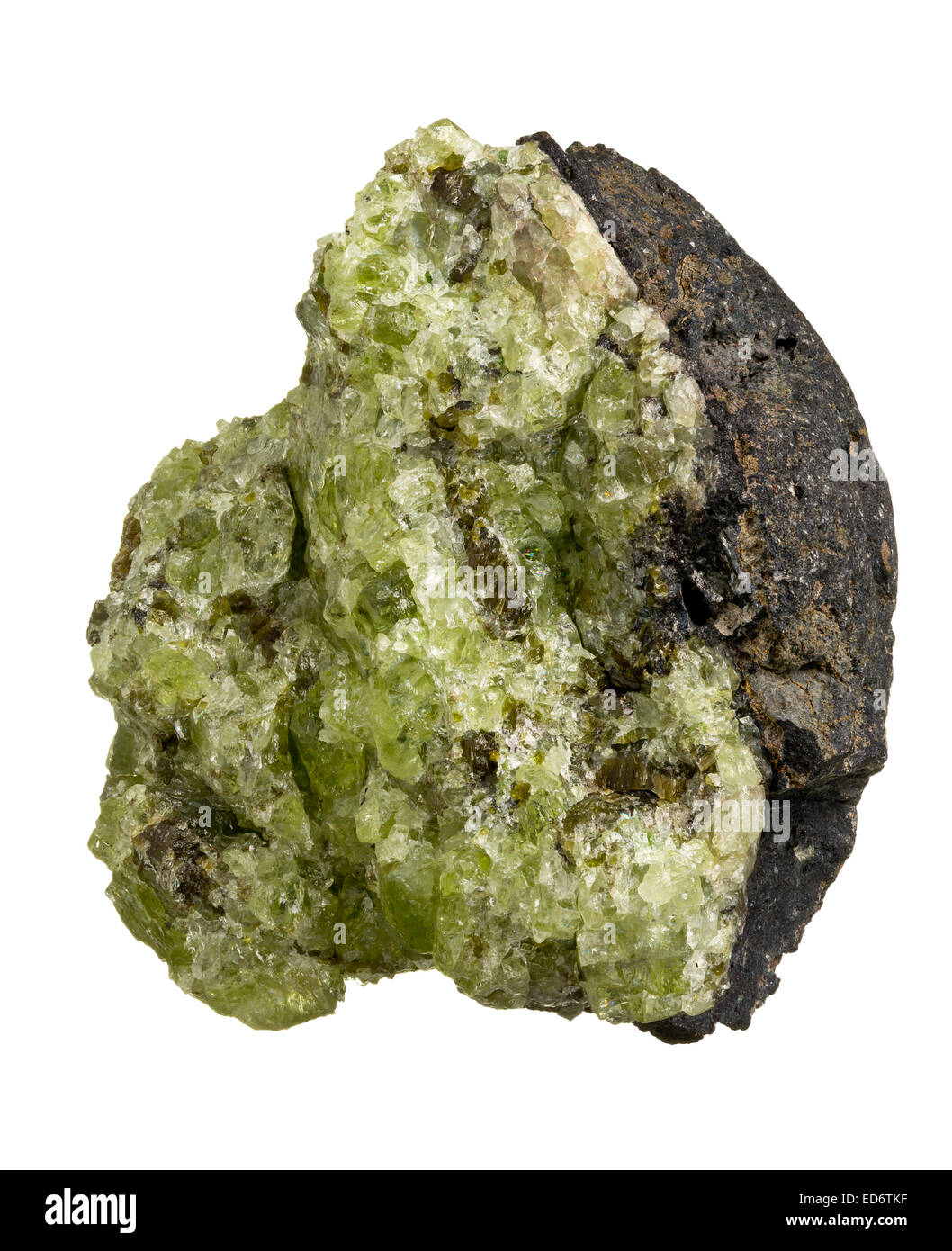 Olivine ((Mg, Fe)2SiO4) on basalt matrix isolated on white background Stock Photo
