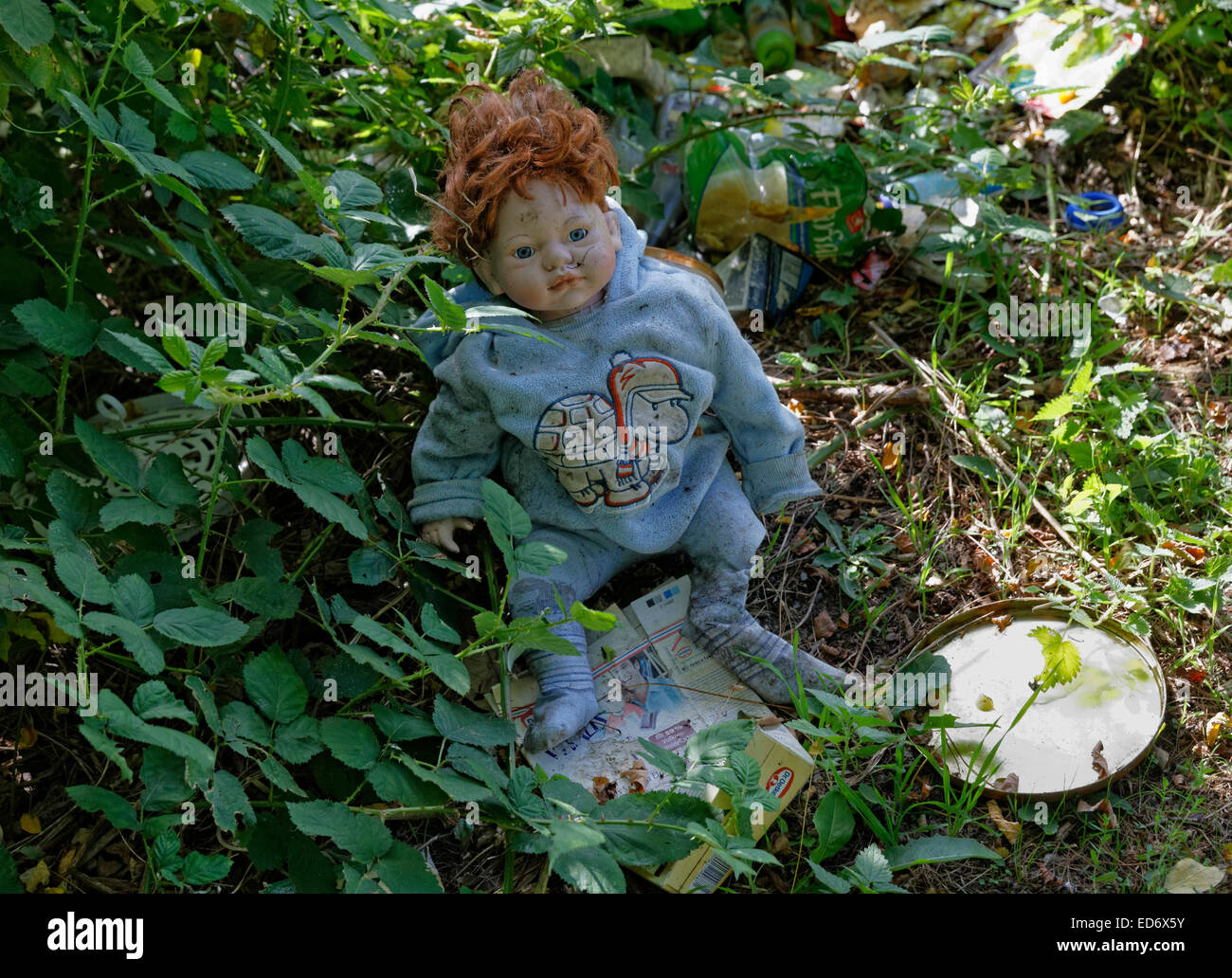 throwed puppet as illegal rubbish in a park in Duisburg - Germany - September 2014 Stock Photo
