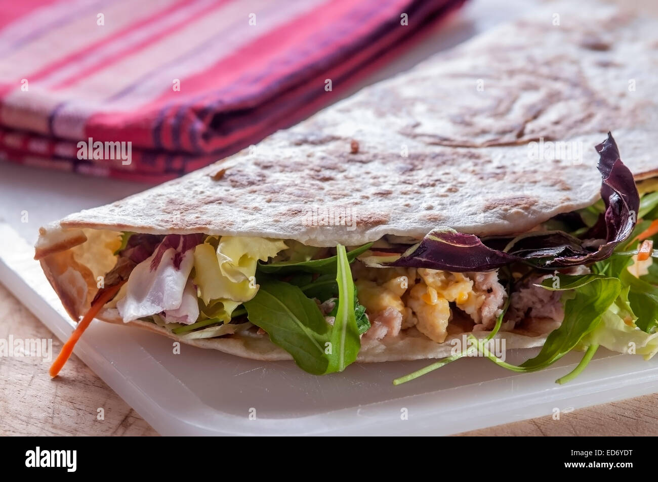 flatbread with tuna eggs and lettuce typical Italian food in northern Italy Stock Photo