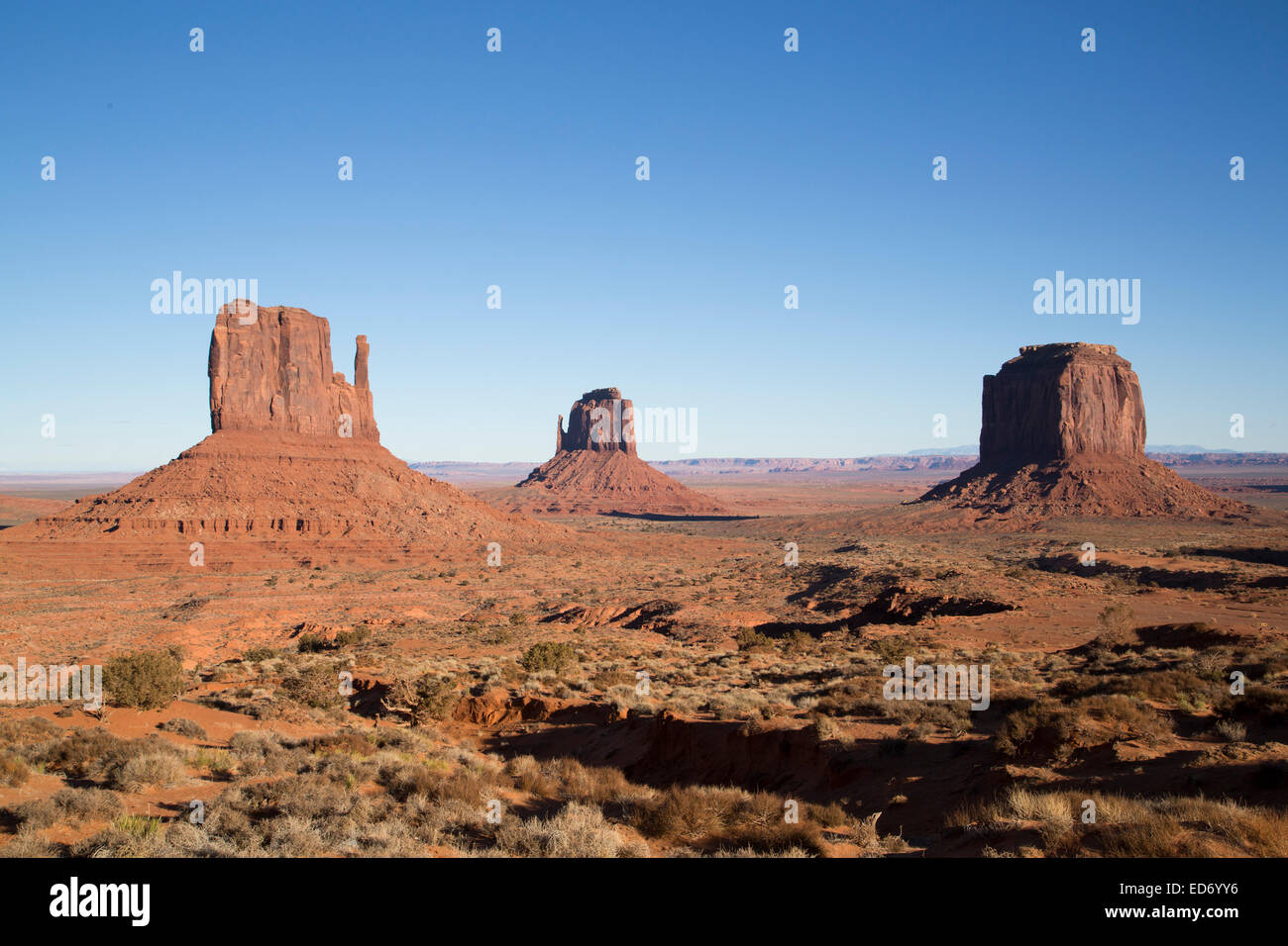 USA, Utah, Monument Valley Navajo Tribal Park, West Mitten Butte (left), East Mitten Butte (center), Merrik Butte (right) Stock Photo