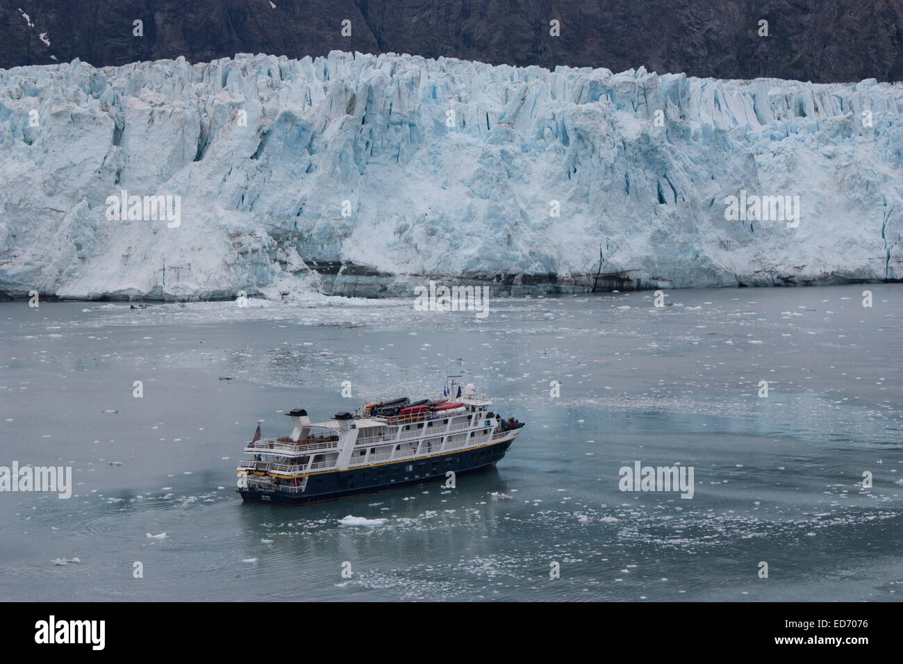 USA, Alaska, Prince William Sound, College Fiord, cruise ship in front of glacier Stock Photo