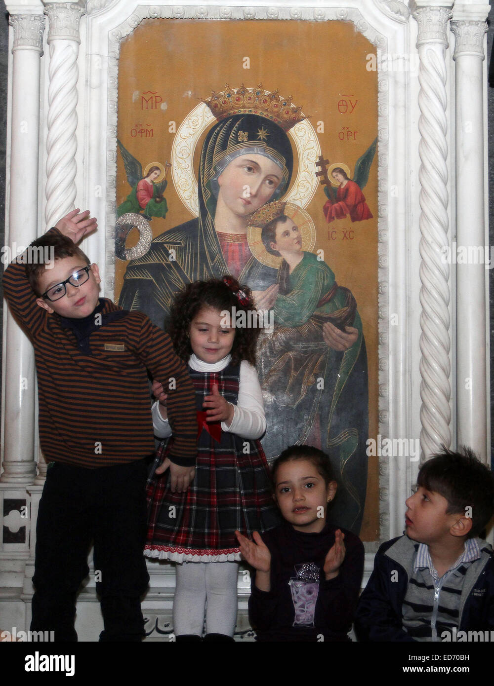 Damascus, Syria. 30th Dec, 2014. Children attend the Christmas celebration at al-Zaitoun Cathedral in Damascus, capital of Syria, on Dec. 30, 2014. About 1,500 Syrian Christian kids and their parents gathered at al-Zaitoun Cathedral in Syria's capital Damascus to take part in a Christmas celebration. About 10 percent of population in Syria are Christian, who suffered persecution in some parts of the country by the hands of the extremist groups. © Bassem Tellawi/Xinhua/Alamy Live News Stock Photo