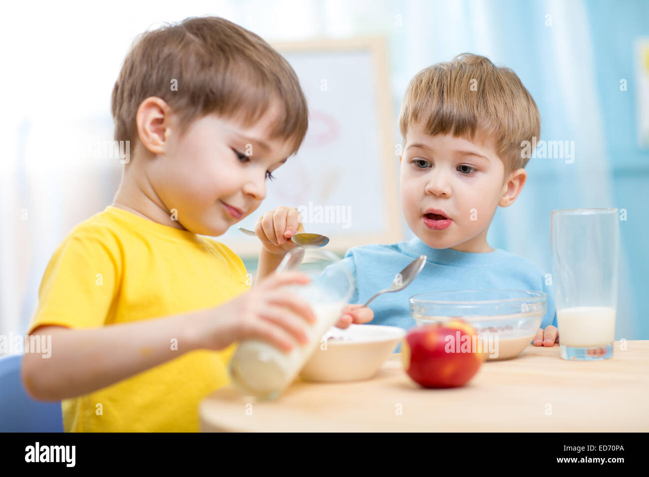 children eating healthy food indoors Stock Photo