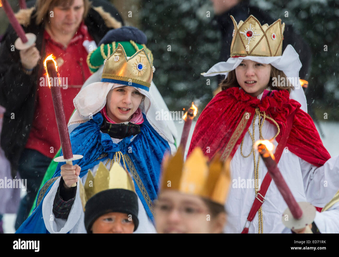 Fellbach, Germany. 30th Dec, 2014. Carol Singers make a procession to