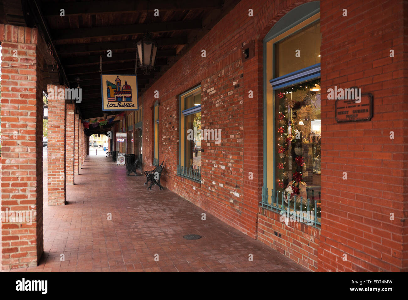 Covered walkway in Market Square, San Antonio, Texas.  It was early morning on a  rainy day during Christmas time. Stock Photo