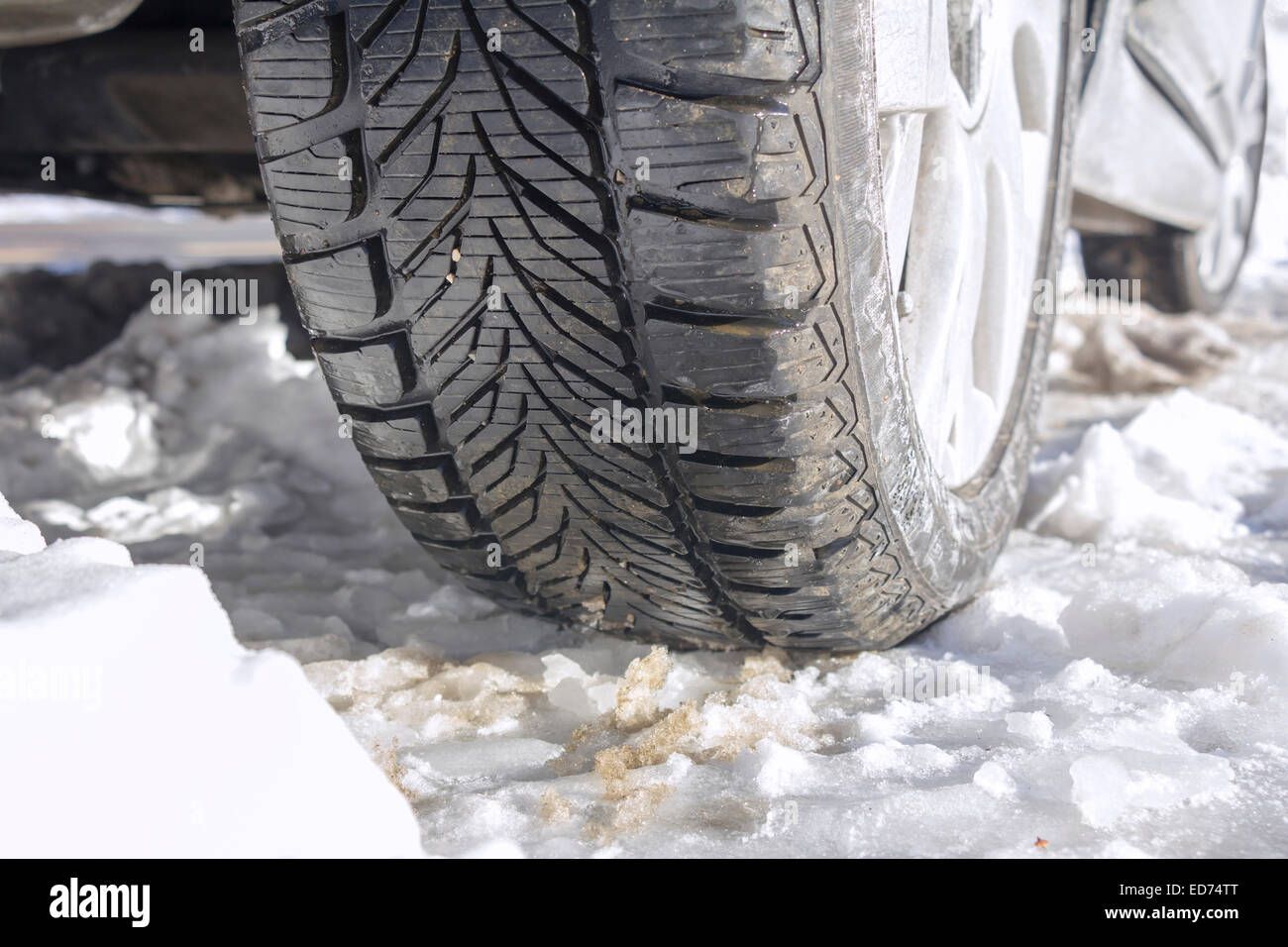 Winter tyres of a cars on a snowy road Stock Photo Alamy