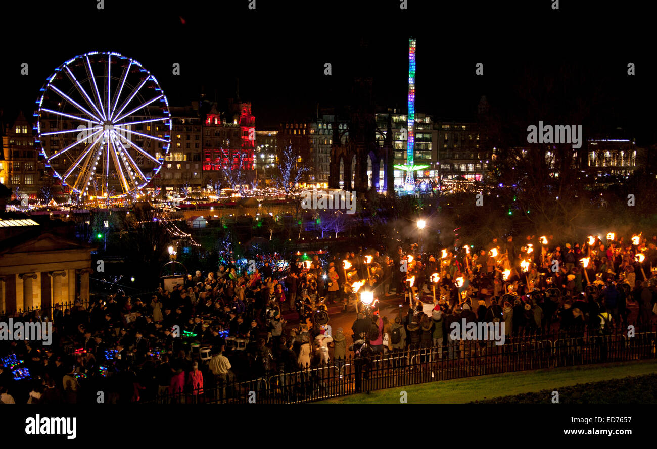 Edinburgh, Scotland, UK. 30 December 2014. 35,000 people were expected to turn out for the start of the three day Hogmanay New Year celebrations in the city. An estimated 8000 torchbearers, led by the Vikings and more than 100 pipers, snaked their way through from George IV Bridge down The Mound and along Princes Street to Calton Hill where they were treated to a fantastic firewoks display. Stock Photo