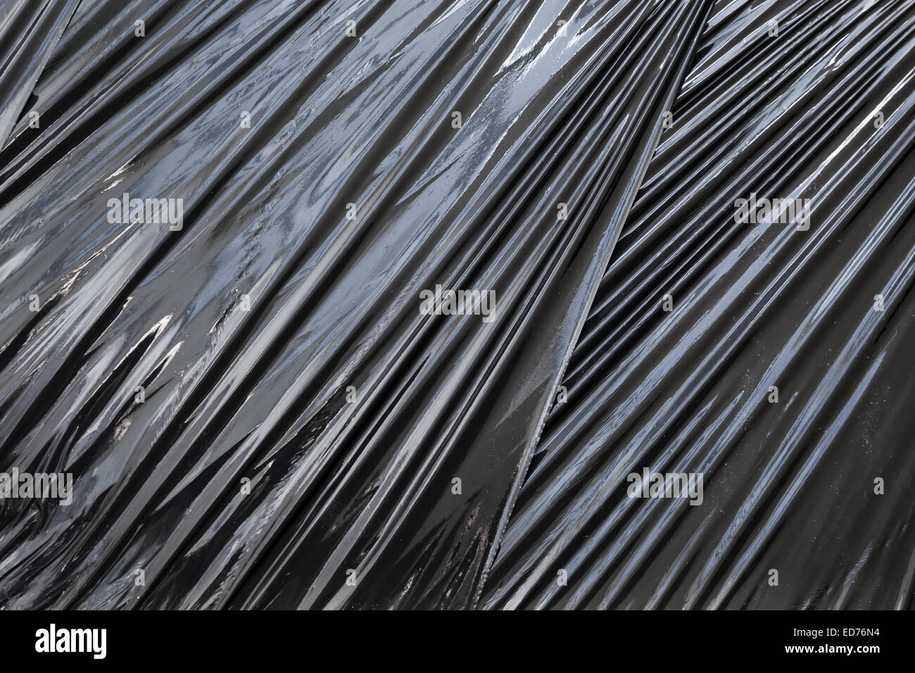 Abstract background photo texture of black polyethylene packing film Stock Photo