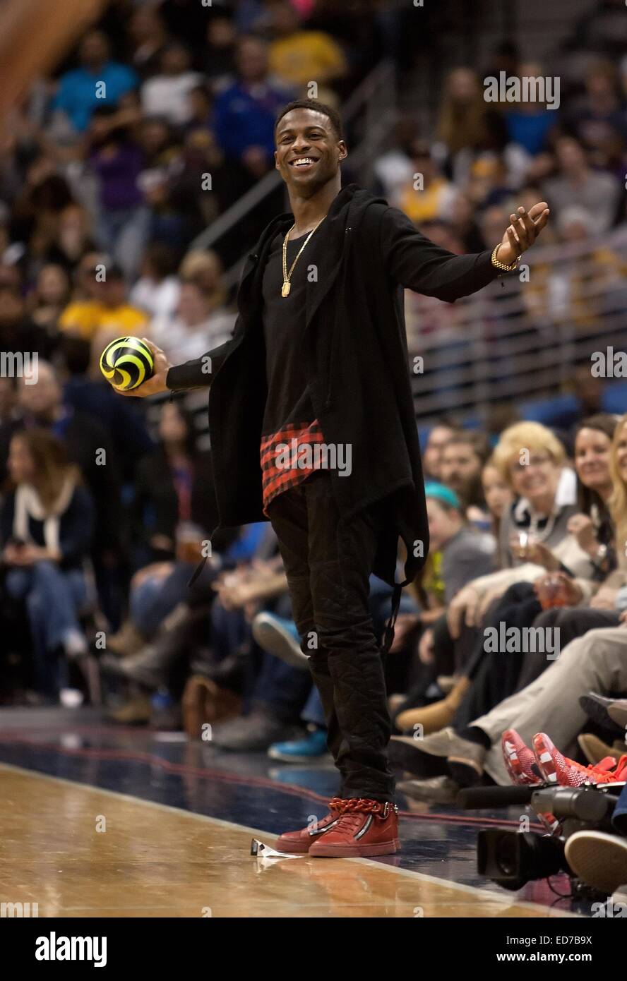Denver, Colorado, USA. 30th Dec, 2014. Denver Broncos WR EMMANUEL SANDERS readies to throw a pass to Nuggets Mascot ROCKY during a break the 3rd. Quarter at the Pepsi Center Tues. night. The Lakers beat the Nuggets 111-103 Credit:  Hector Acevedo/ZUMA Wire/Alamy Live News Stock Photo