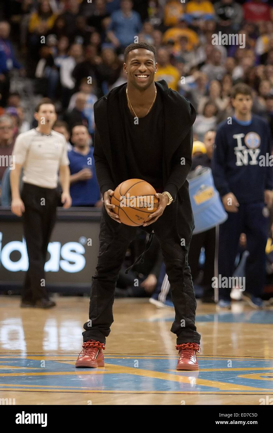 Denver, Colorado, USA. 30th Dec, 2014. Denver Broncos WR EMMANUEL SANDERS readies to shoot a shot at the basket backwards from center court after Nuggets Mascot ROCKY sank his shot during a break the 3rd. Quarter at the Pepsi Center Tues. night. The Lakers beat the Nuggets 111-103 Credit:  Hector Acevedo/ZUMA Wire/Alamy Live News Stock Photo