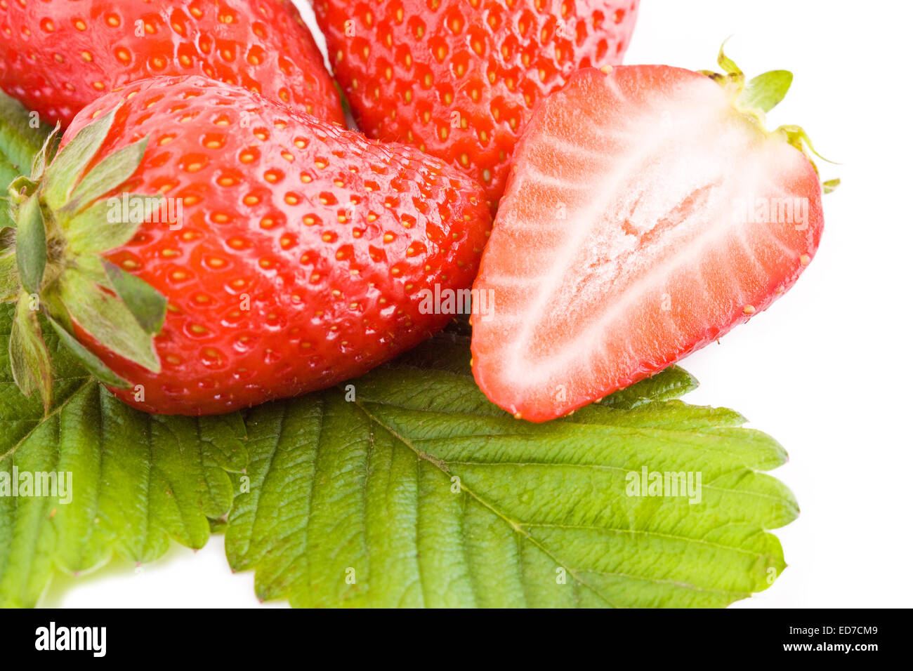 Closeup on fresh strawberries isolated on white background Stock Photo ...
