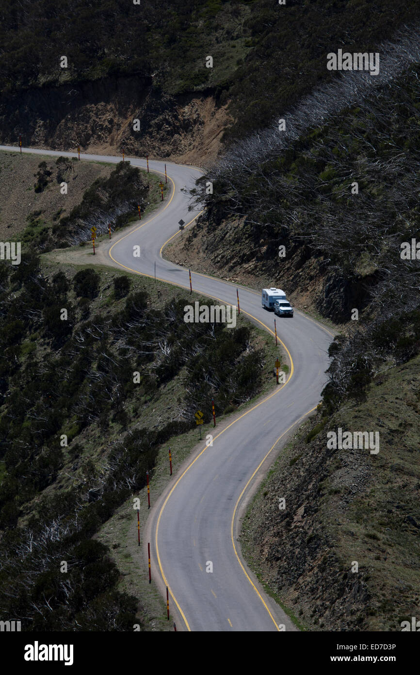 Four Wheel drive towing a caravan negotiates the The Great Alpine Road