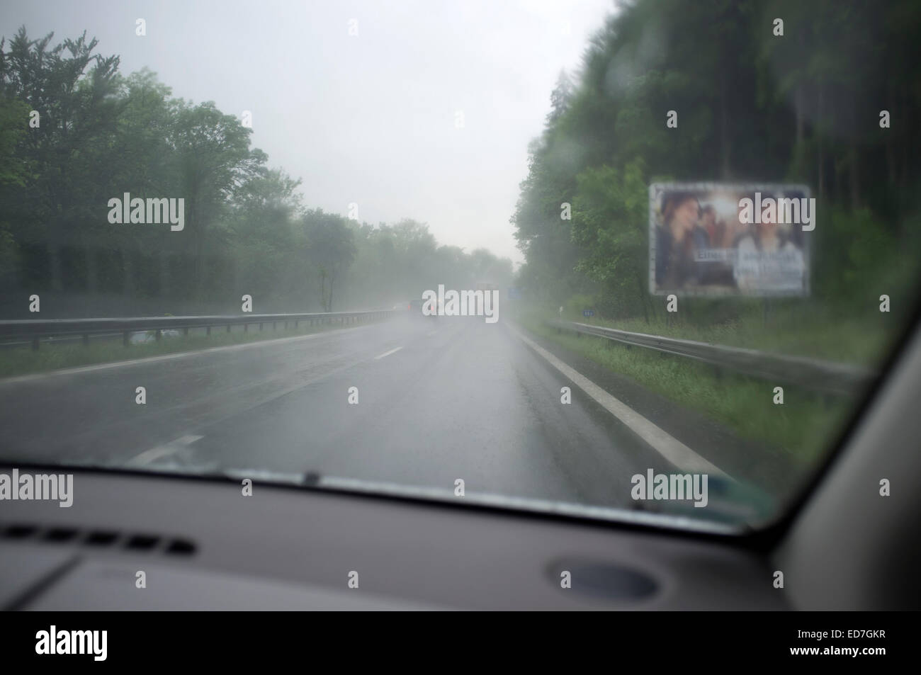 Driving in wet conditions on the A9 autobahn, Bavaria, Germany. Stock Photo