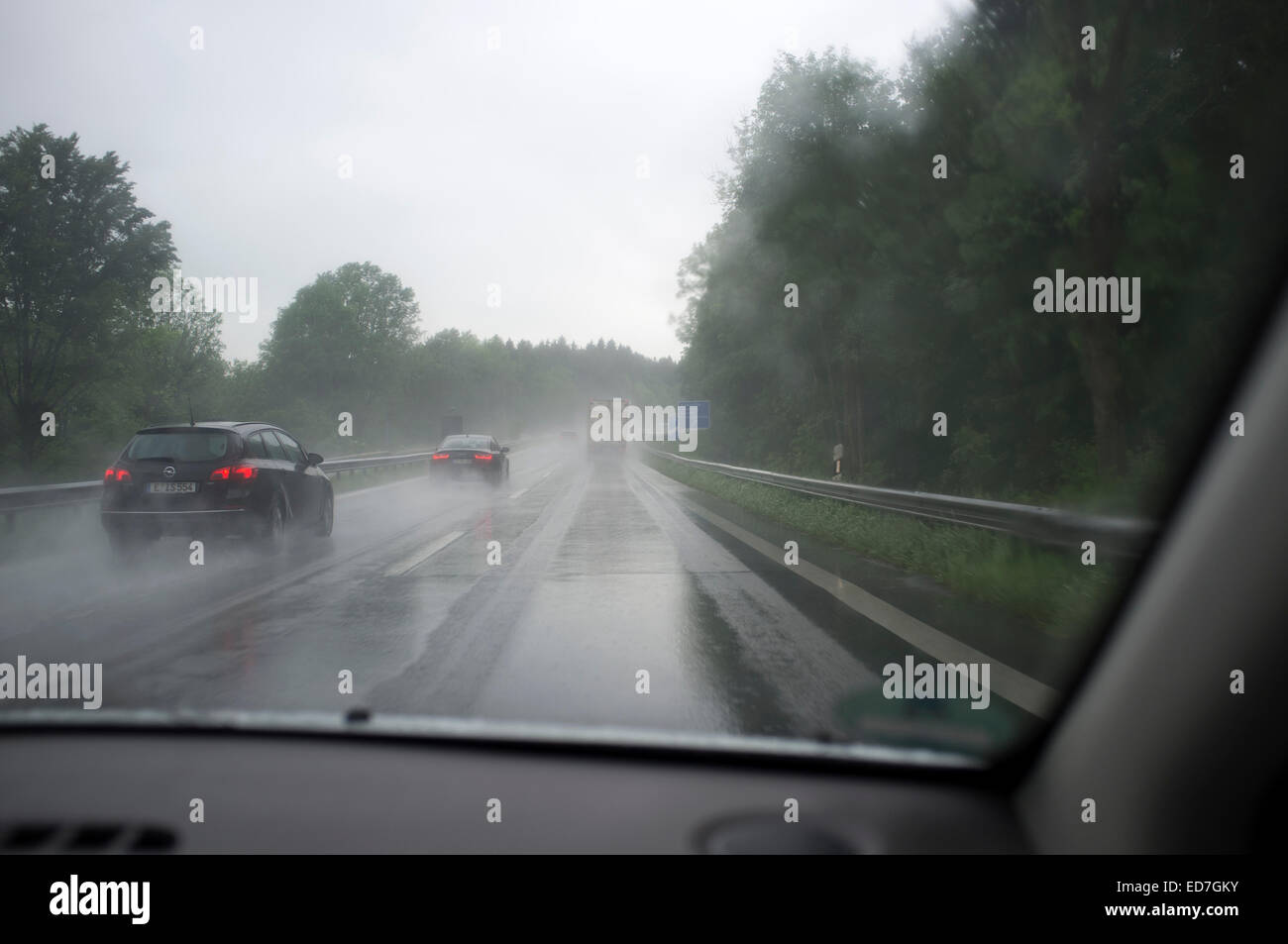 Driving in wet conditions on the A9 autobahn, Bavaria, Germany. Stock Photo