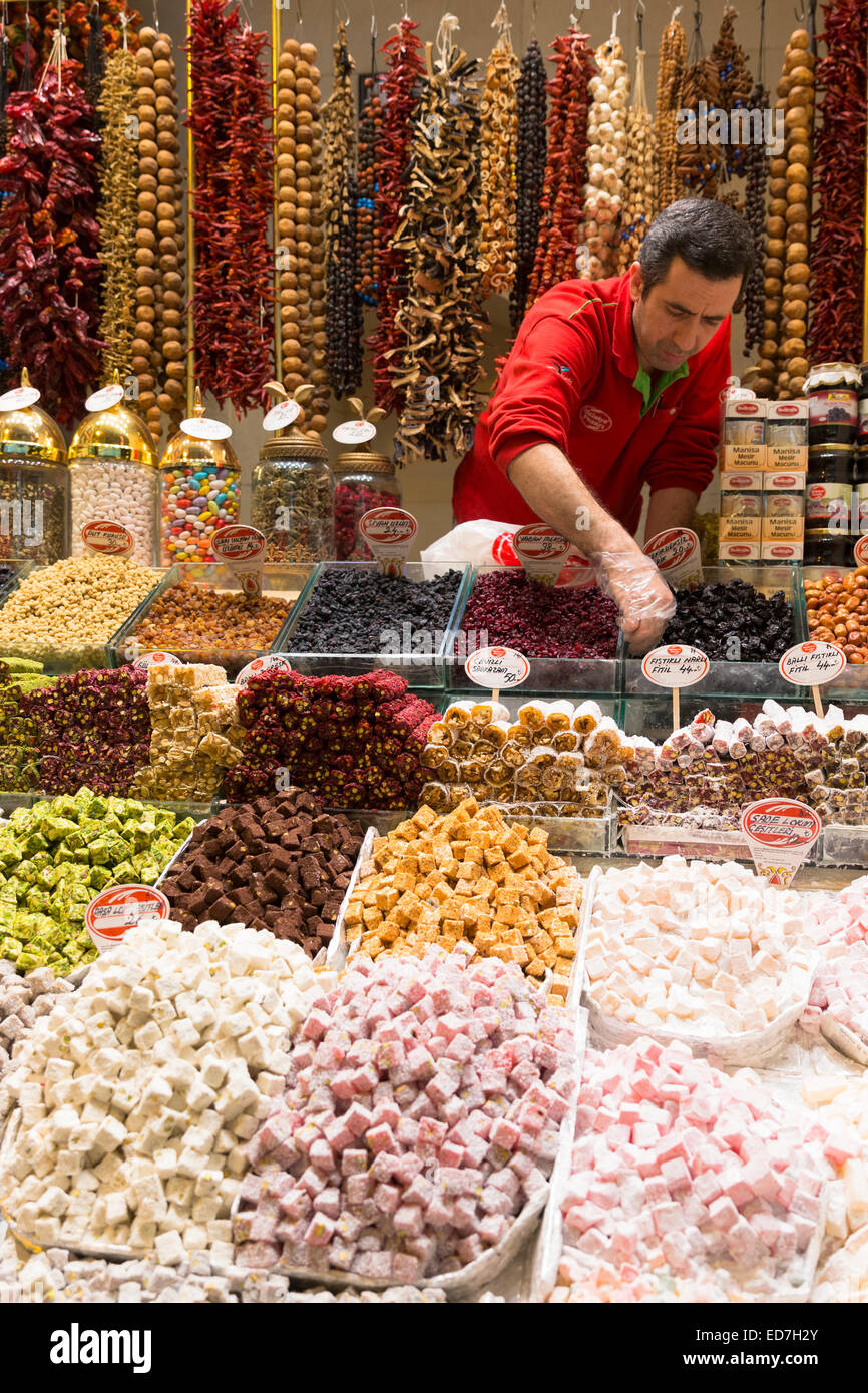 Seller of traditional sweetmeats Turkish Delight, Lokum in Misir Carsisi Egyptian Bazaar food and spice market, Istanbul, Turkey Stock Photo