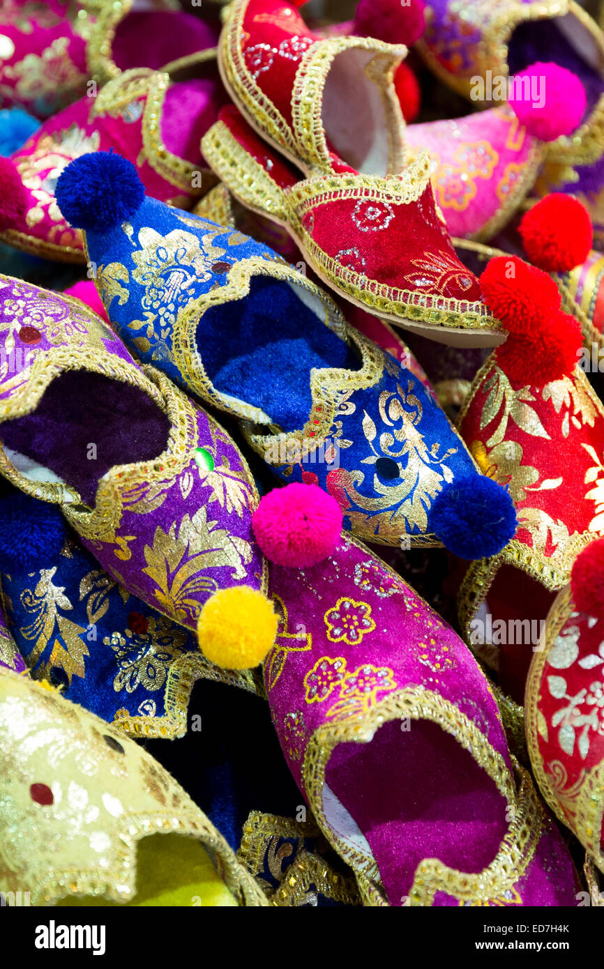 Traditional Turkish silk slippers ornate embroidered in the Misir Carsisi Egyptian Bazaar market in Istanbul, Turkey Stock Photo