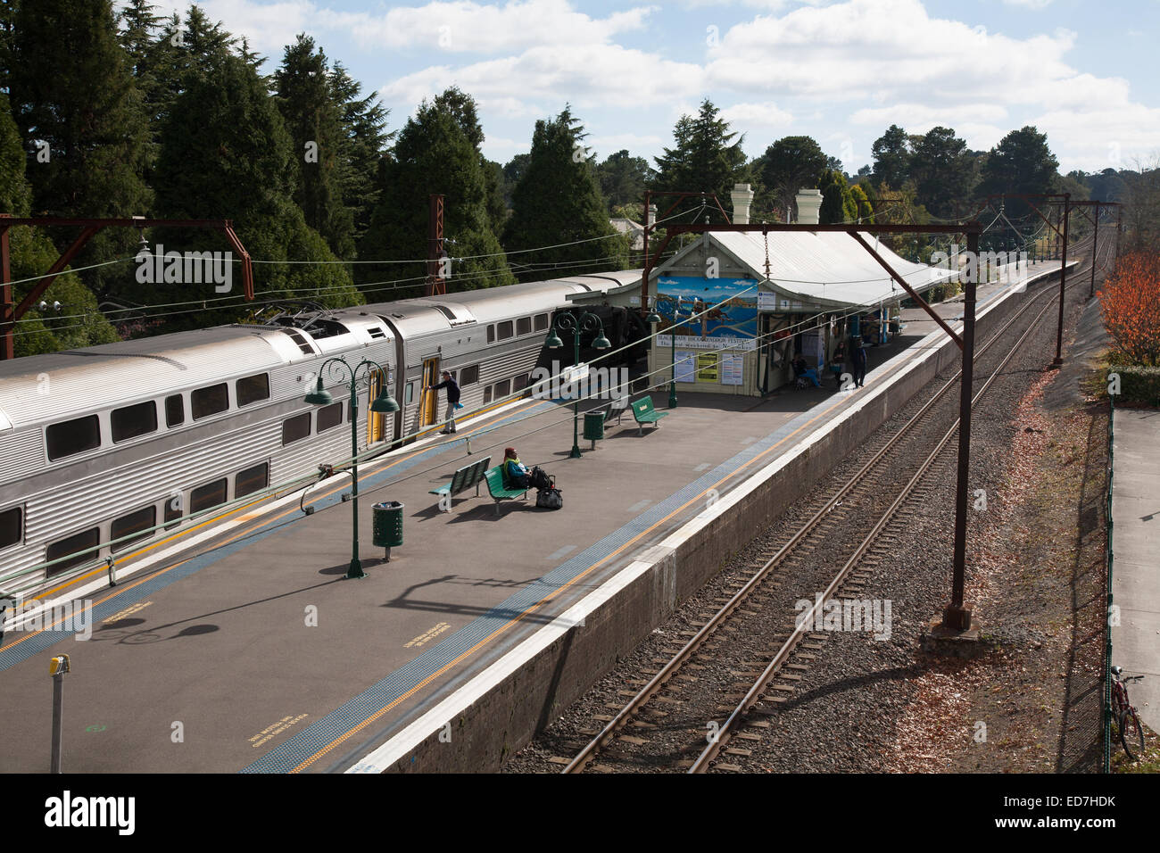 Passengers await the Intercity electric powered train at Blackheath