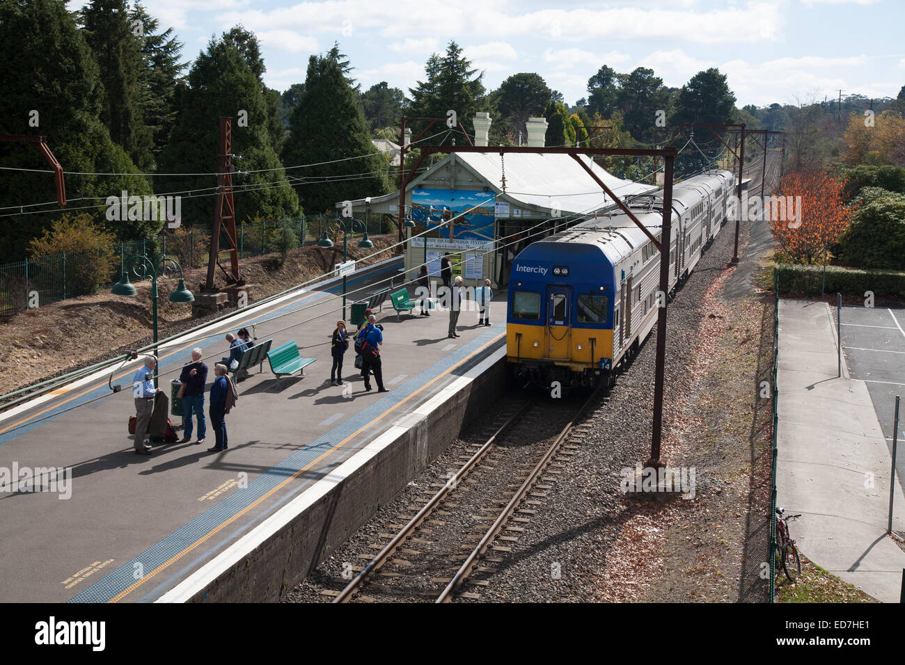 Passengers await the Intercity electric powered train at Blackheath