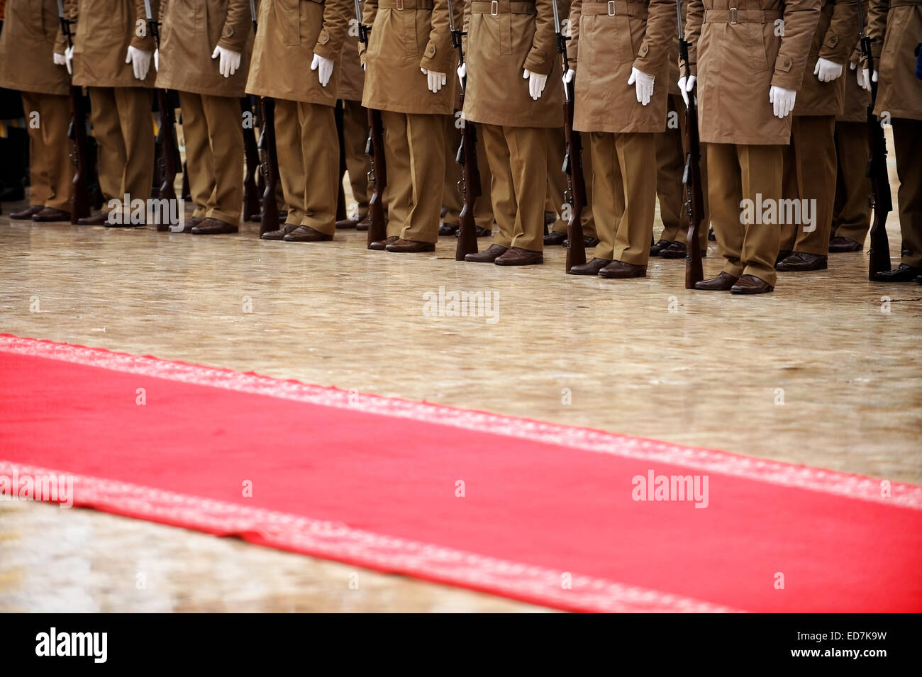 Guard of honor soldiers in front of the red carpet during military ceremony Stock Photo