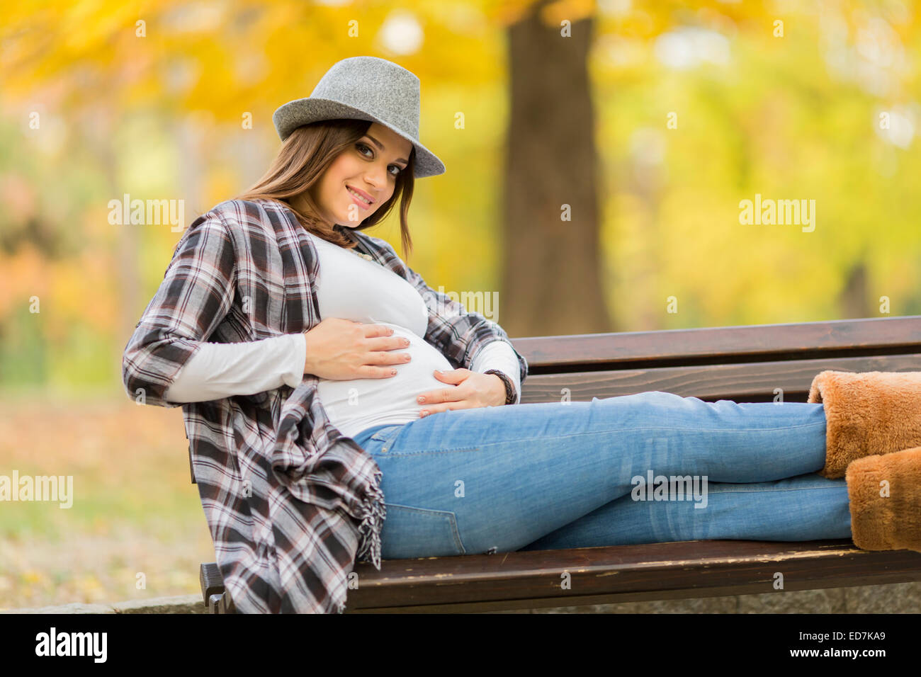 Young pregnant woman in the autumn park Stock Photo - Alamy