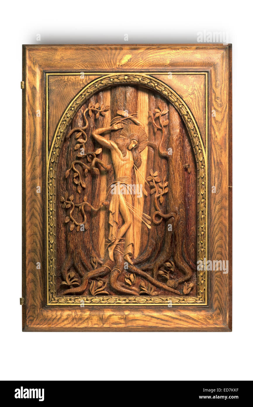 carved picture Saint Sebastian on a white Stock Photo
