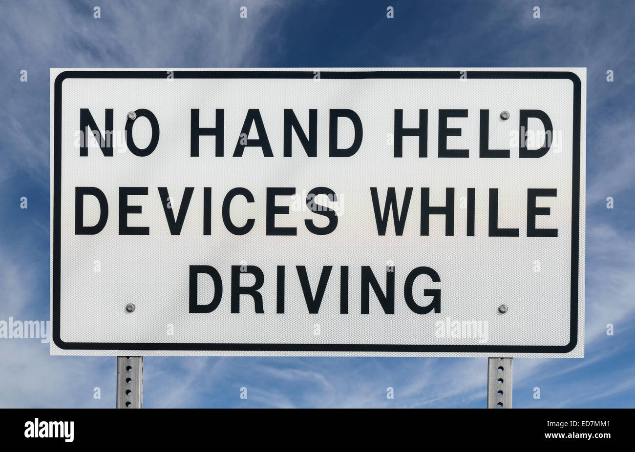 No hand held devices while driving sign. Stock Photo