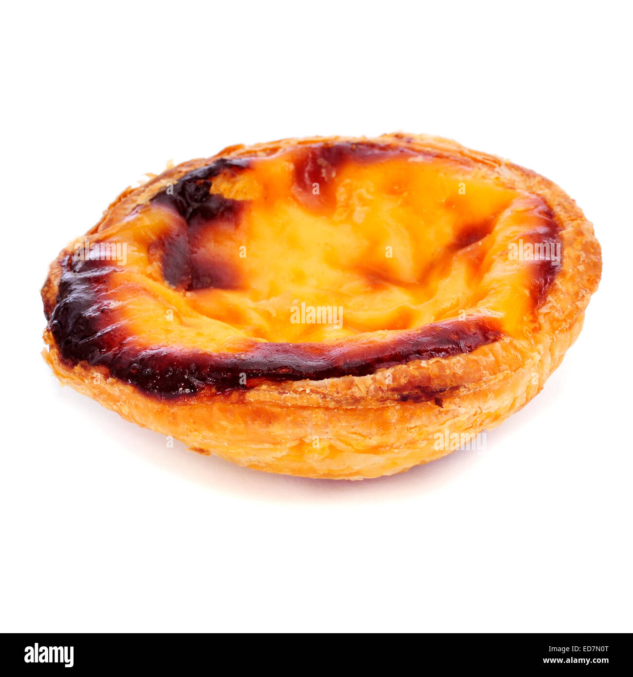 a pastel de nata, typical Portuguese egg tart pastry, on a white background Stock Photo