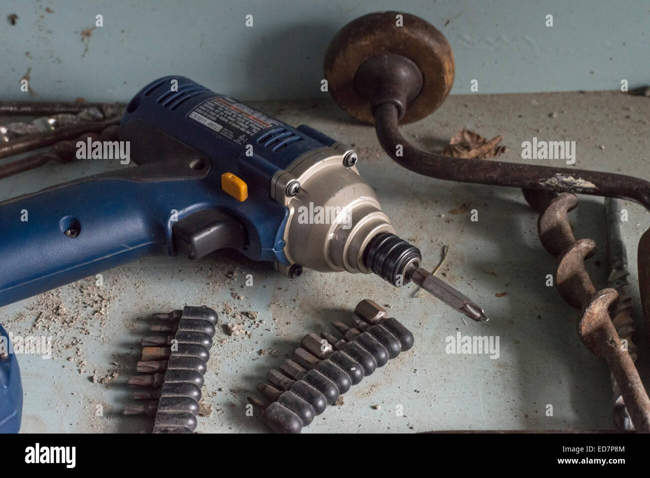 Old cordless drill abandoned in toolshed Stock Photo Alamy