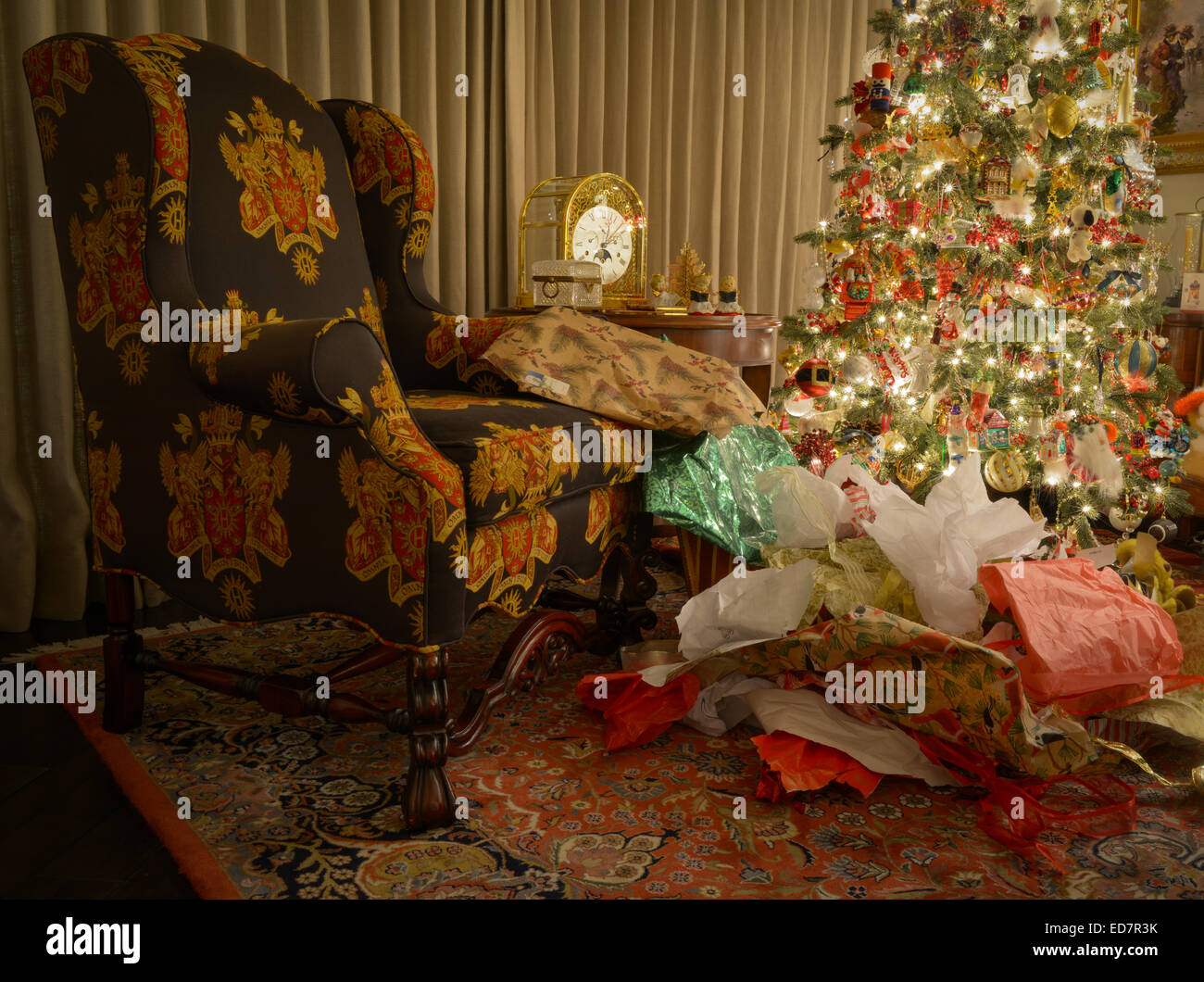pile of wrapping paper next to Christmas tree Stock Photo