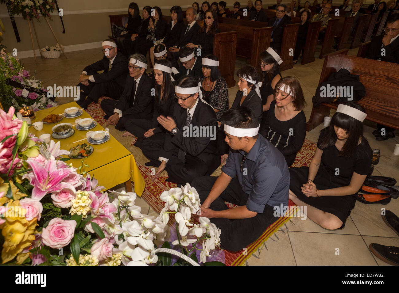Family members, mourners at Vietnamese funeral service, Little Saigon district, city of Westminster, Orange County, California Stock Photo