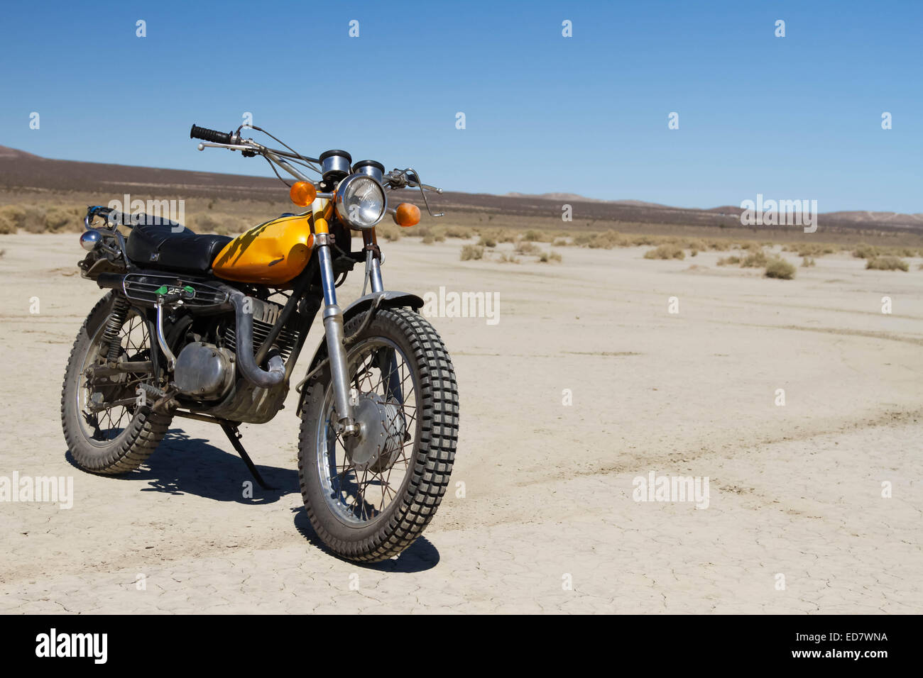 A 70's motorcycle in the desert. Stock Photo