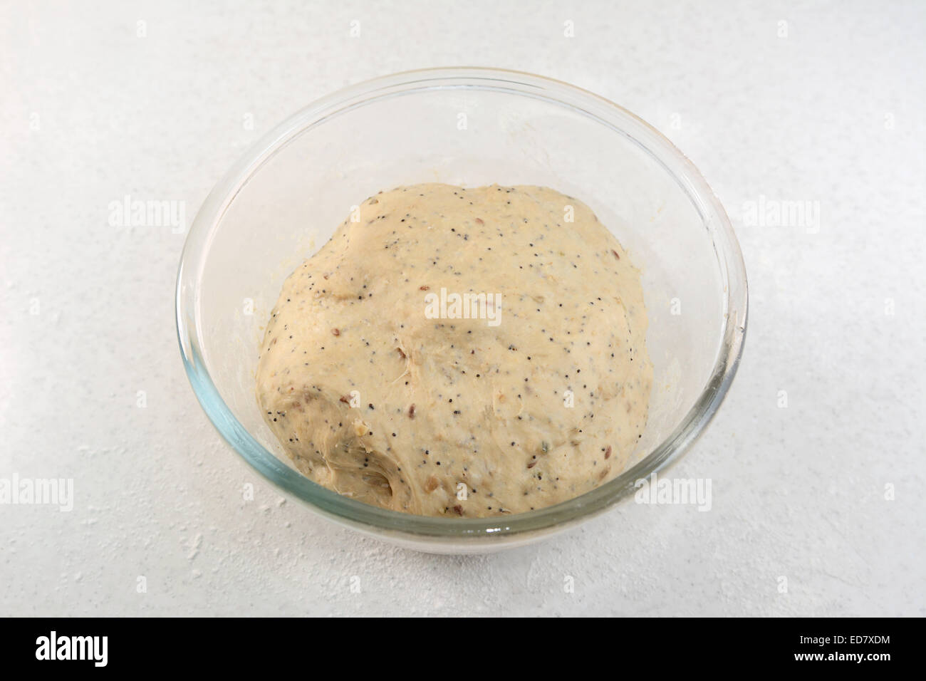 Proved bread dough, having risen and doubled in size in a glass bowl Stock Photo