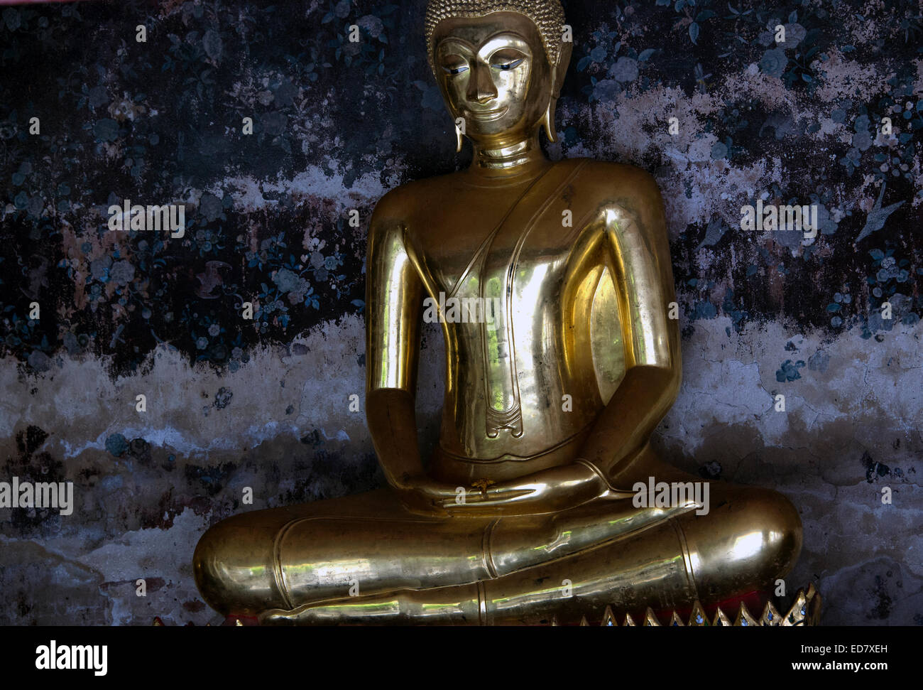 Gold statue of meditating Buddha in Bangkok, Thailand Stock Photo