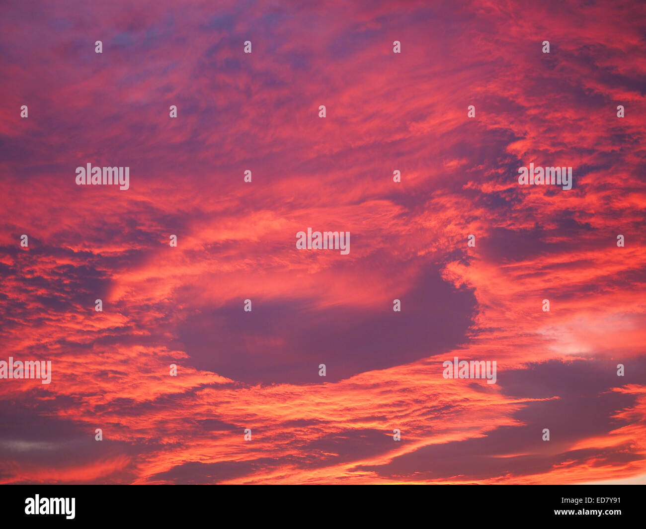 Red clouds in the sky at sunset Stock Photo Alamy