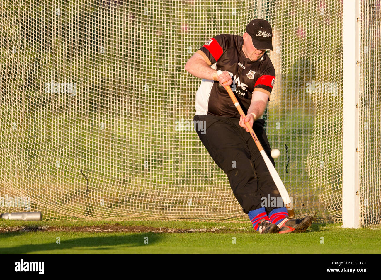 Kingussie goalkeeper Craig Dawson makes a save during the match.  Kingussie v Newtonmore in the Orion Premiership at The Dell. Stock Photo