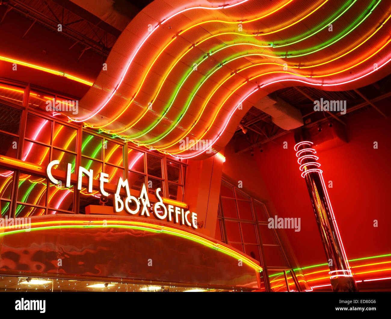 Retro glowing neon lights at movie theater box office Stock Photo