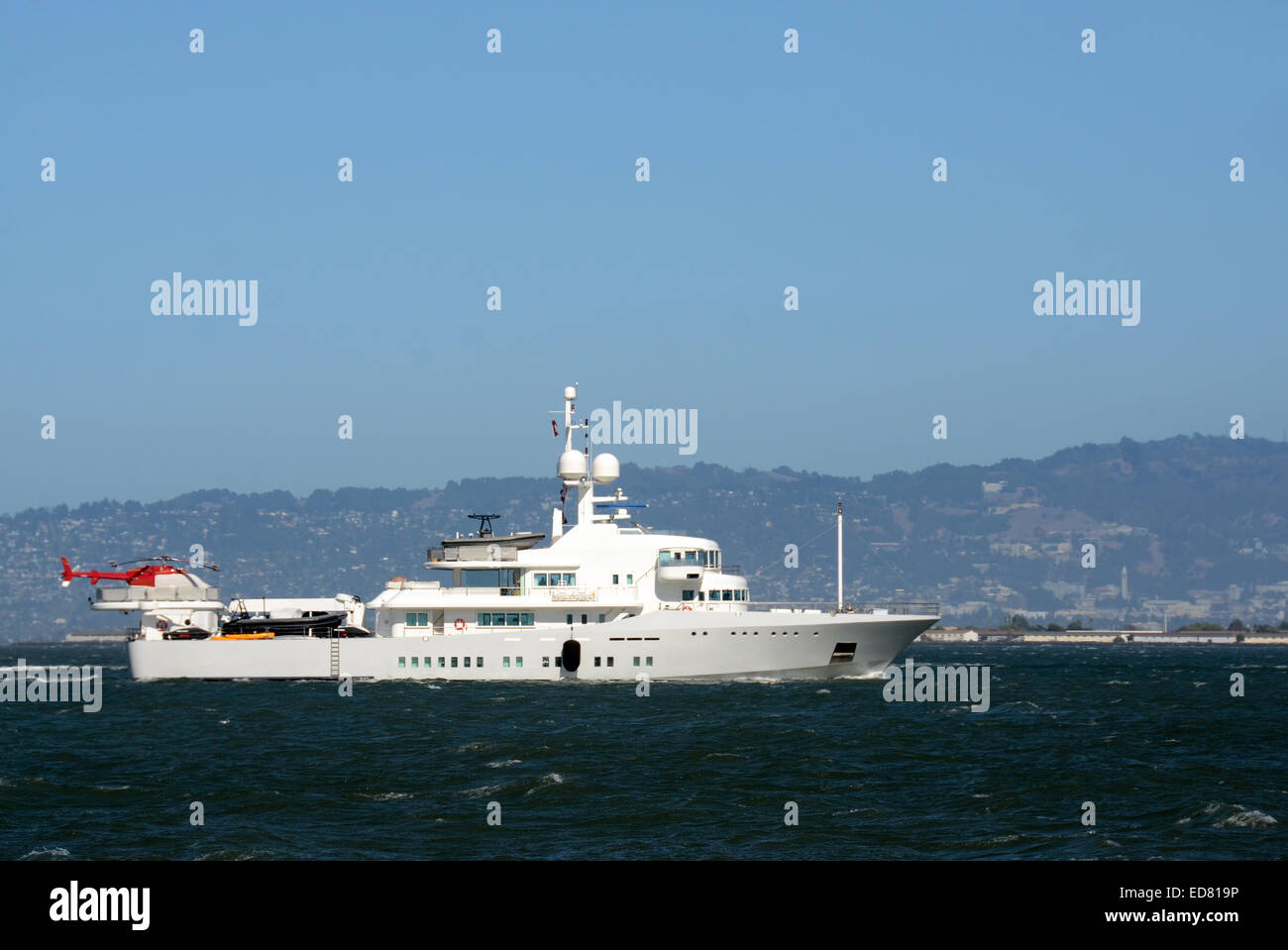 Luxury yacht with helicopter on the back side view Stock Photo