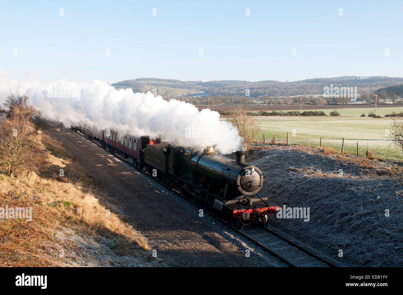 Steam train on the Gloucestershire and Warwickshire Railway in winter, Hailes, Gloucestershire, UK Stock Photo