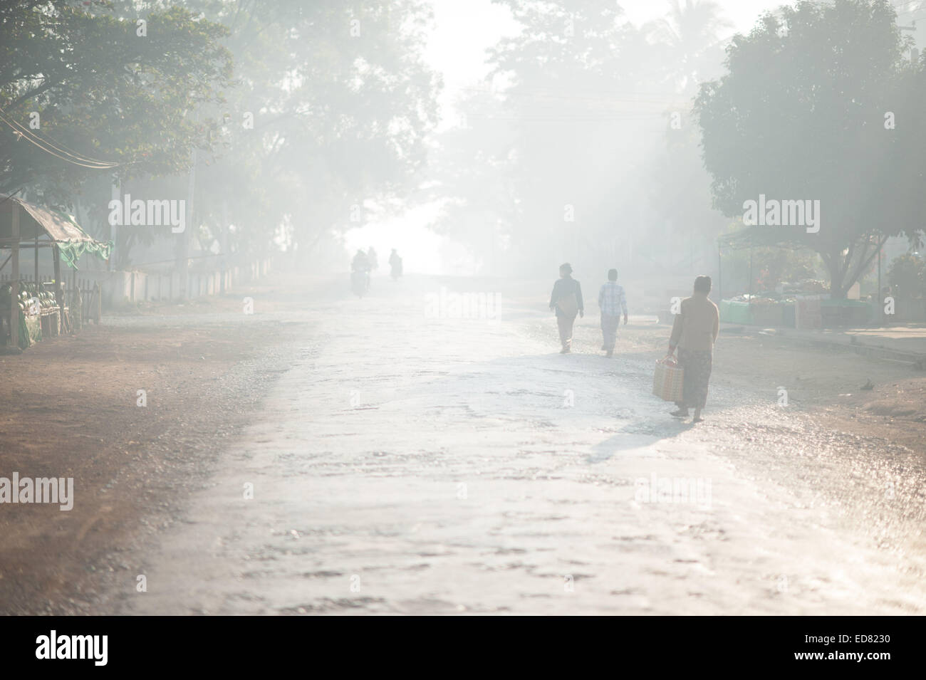 Diffuse glow of the sun through smog in the early morning, Loikaw Stock Photo