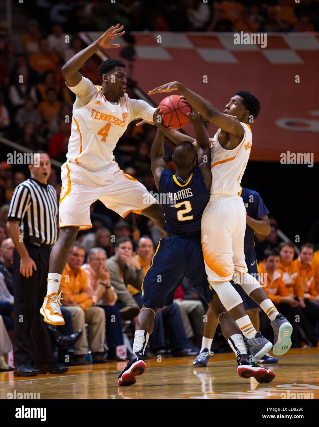 December 31, 2014: Josh Richardson #1 and Armani Moore #4 of the Tennessee Volunteers defend against Devin Harris #2 of the East Tennessee State Buccaneers during the NCAA basketball game between the University of Tennessee Volunteers and the East Tennessee State University Buccaneers at Thompson Boling Arena in Knoxville TN Stock Photo