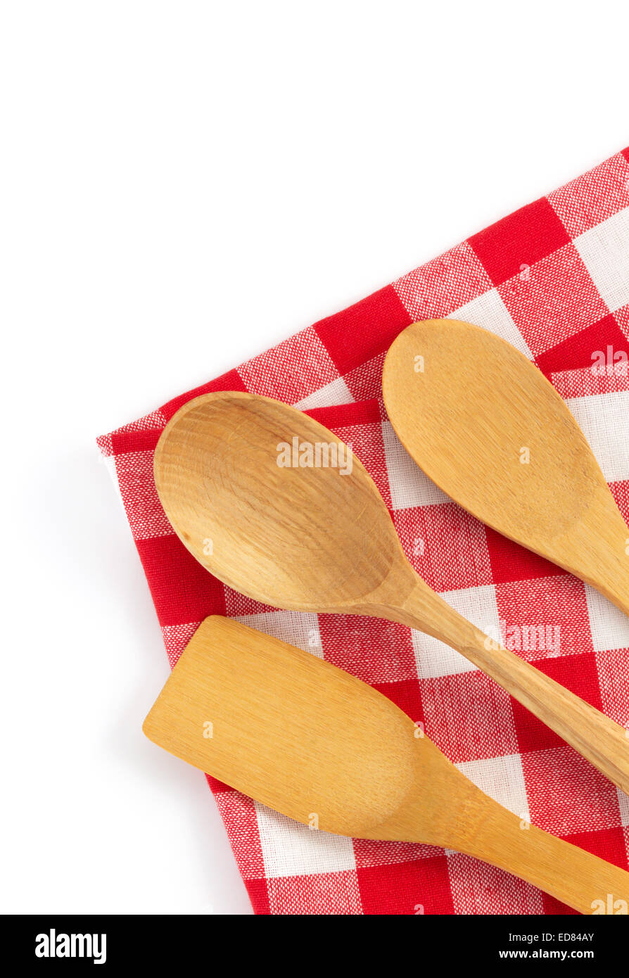 wooden kitchen tools at cloth napkins isolated on white background ...