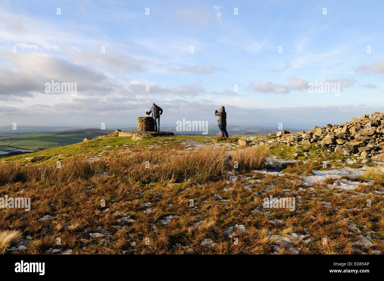 A couple and their dog take photographs at the Pembrokeshire National Park  Observation Point on Foel Eryr Preseli Hills Stock Photo