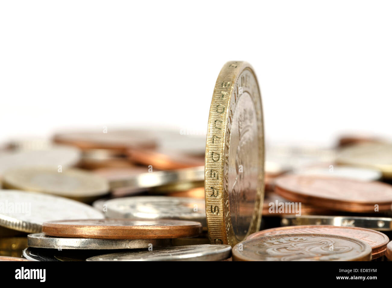 One coin towers over other Stock Photo - Alamy