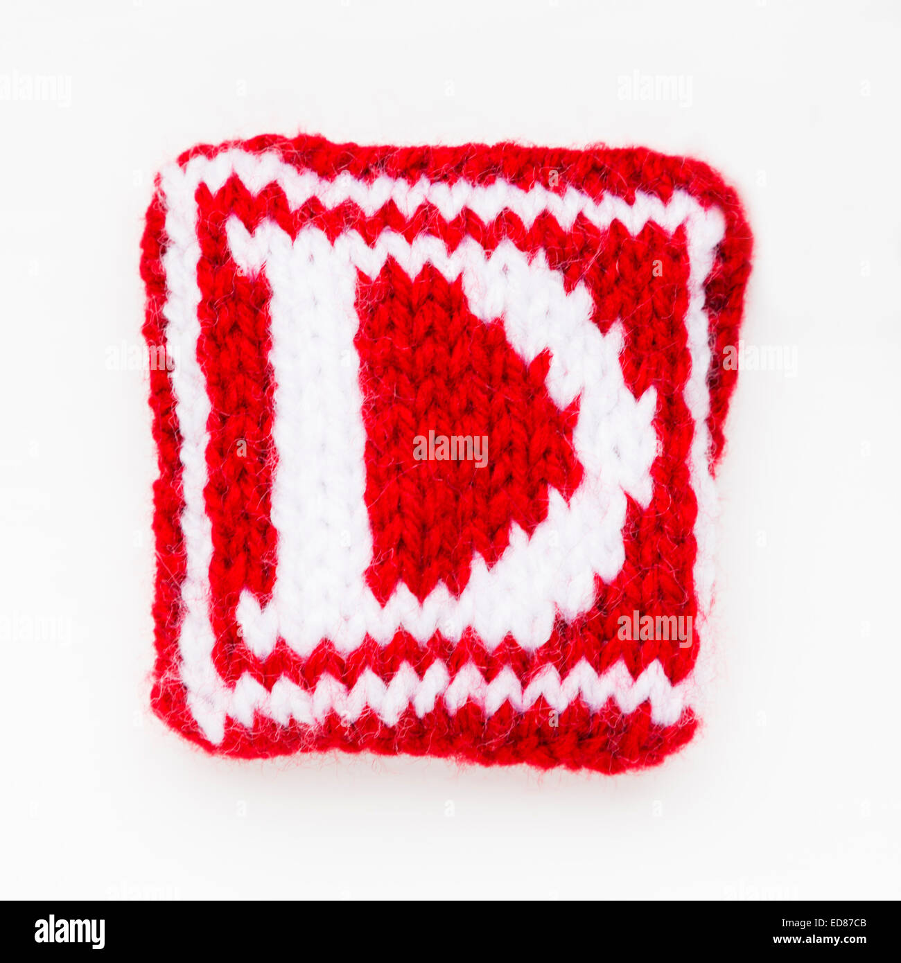 Knitted letter D woollen lettering. Stock Photo