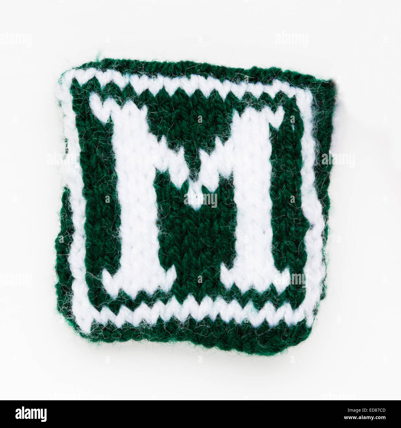 Knitted letter M woollen lettering. Stock Photo