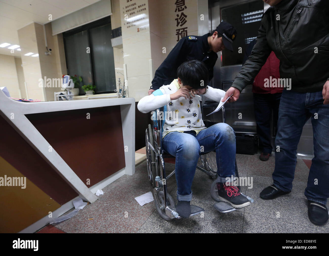 Shanghai, China. 1st Jan, 2015. An injured person is seen at a hospital in Shanghai, east China, Jan. 1, 2015. New Year celebrations in Shanghai's bund area went astray Wednesday night as a stampede resulted in 36 people dead and 47 injured. The city has set up a working team for rescue operations and to deal with the aftermath. © Ding Ting/Xinhua/Alamy Live News Stock Photo