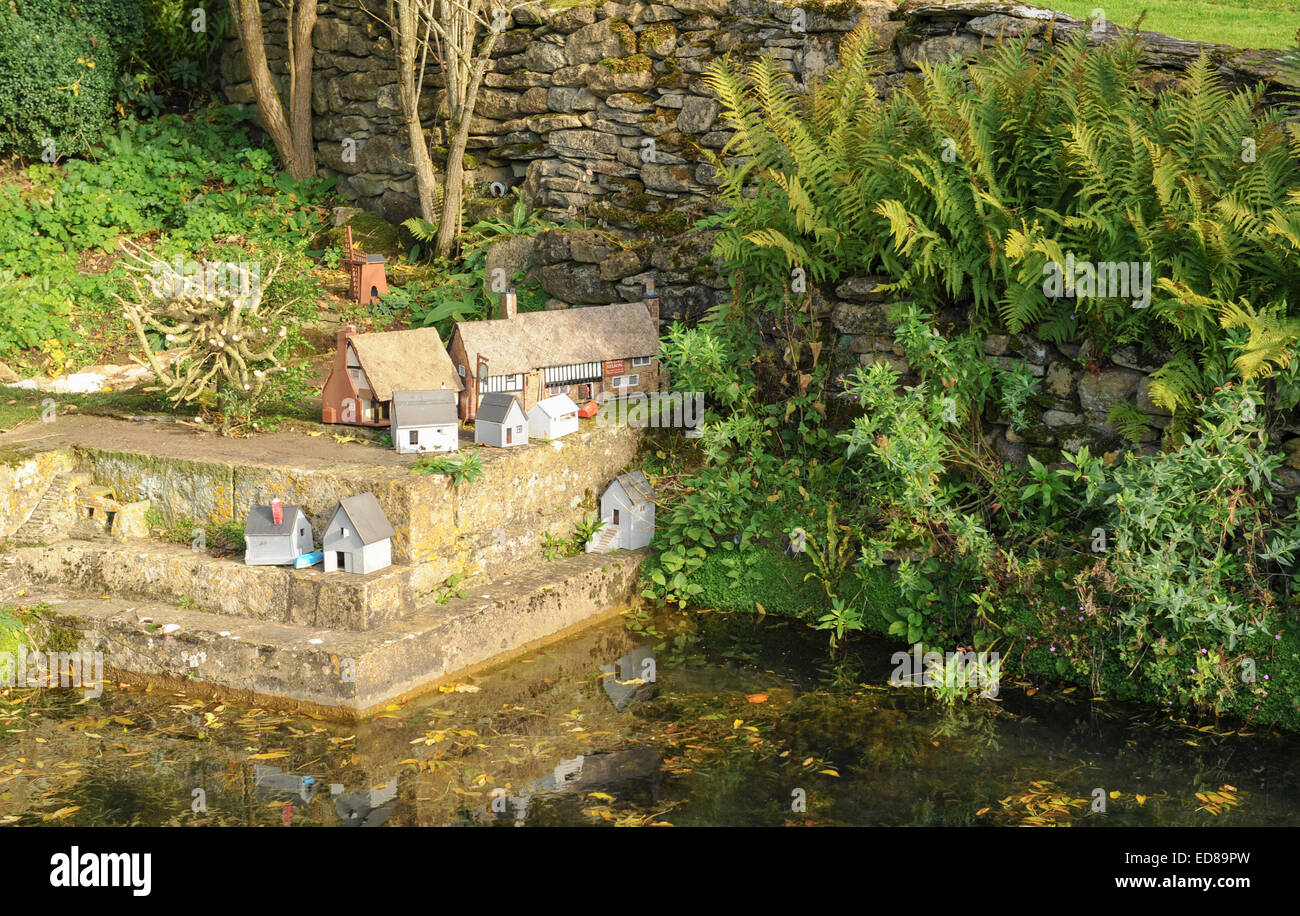 Miniature Houses by a Pond at Snowshill Manor, near the Traditional Cotswold Village of Broadway, Gloucestershire, England, UK Stock Photo